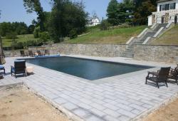 fiberglass pool with retaining wall